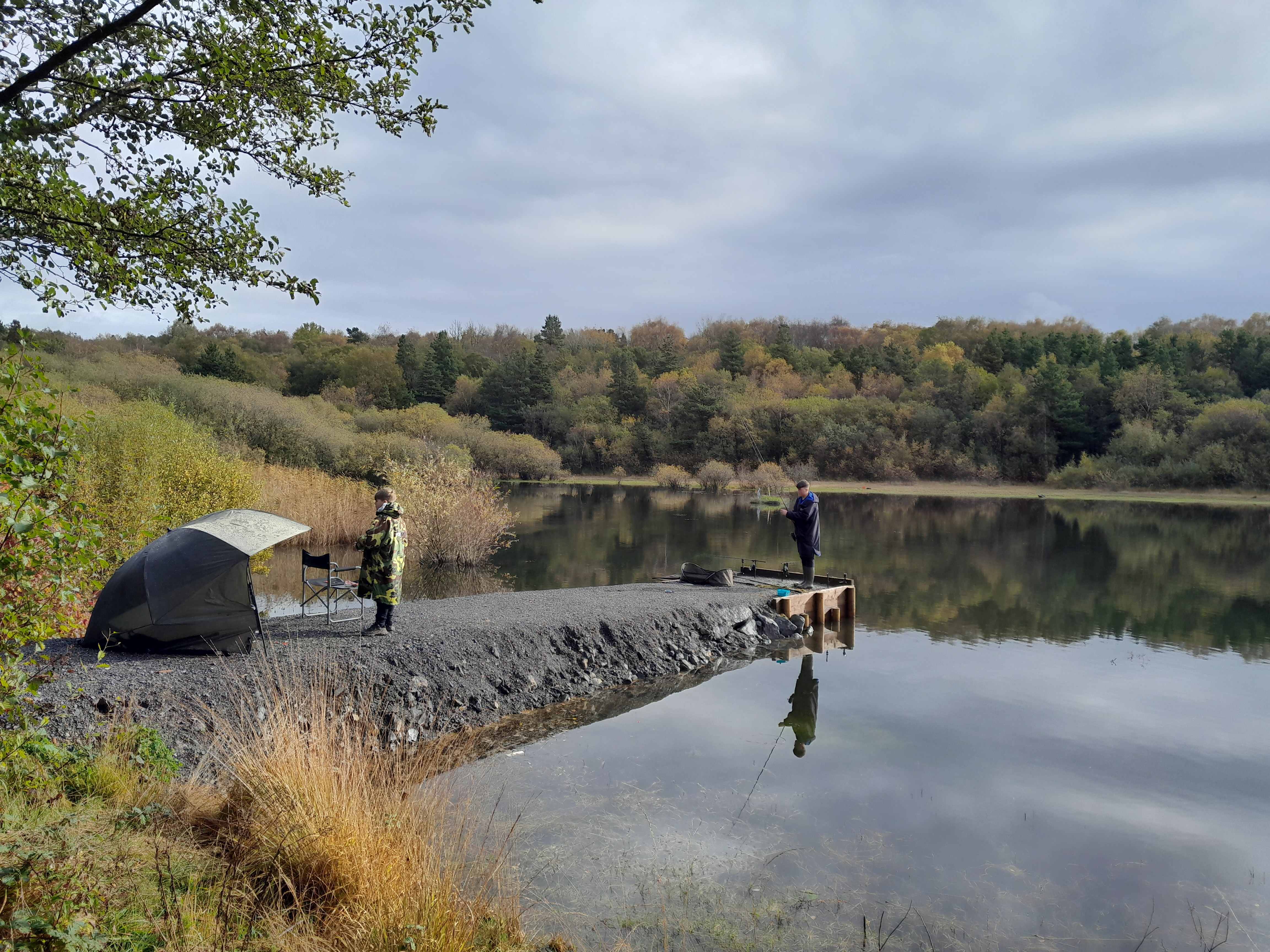 Two anglers at a fishing post at Pluck Lake