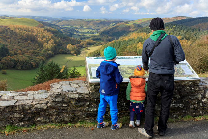 Man and children at viewpoint Man and children at viewpoint