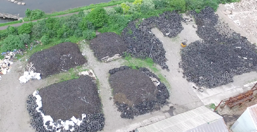 An aerial image of piles of waste tyres An aerial image of piles of waste tyres
