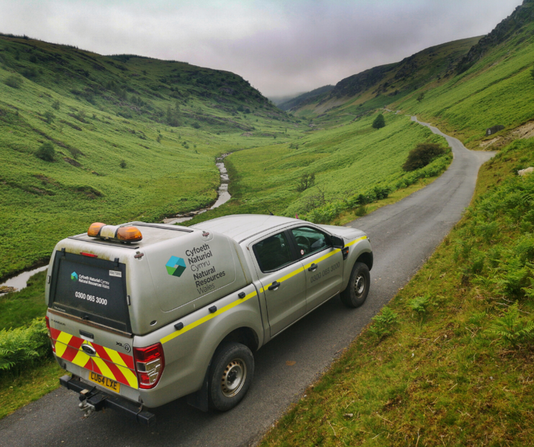 Image of an Natural Resources Wales vehicle on a road in the countryside Image of an Natural Resources Wales vehicle on a road in the countryside