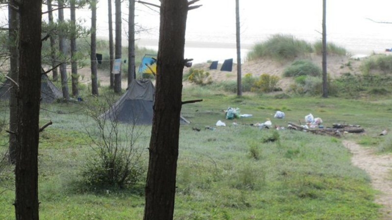 Tent and litter in Newborough National Nature Reserve Tent and litter in Newborough National Nature Reserve