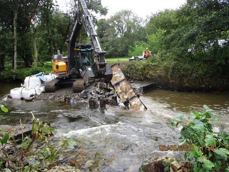 A crane lifts out the weir at Vicar's Mill on the Eastern Cleddau. A crane lifts out the weir at Vicar's Mill on the Eastern Cleddau.