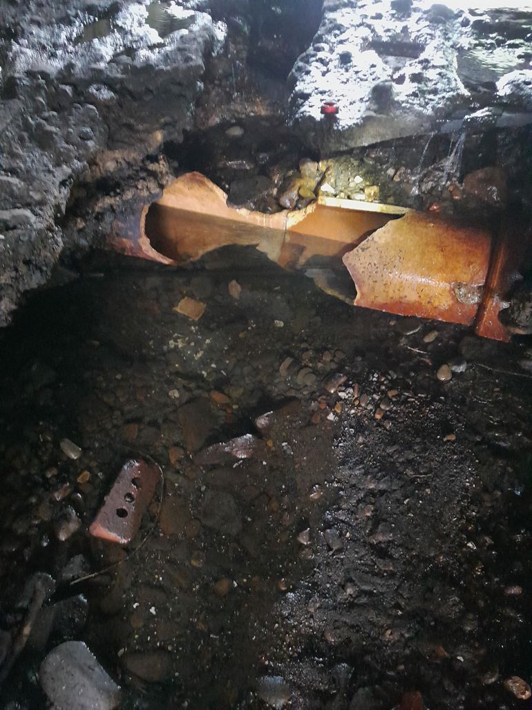 The damaged pipe which caused the incident at the river bed under a bridge The damaged pipe which caused the incident at the river bed under a bridge