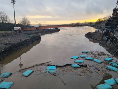 Image of flood on Llangennerch train derailment site