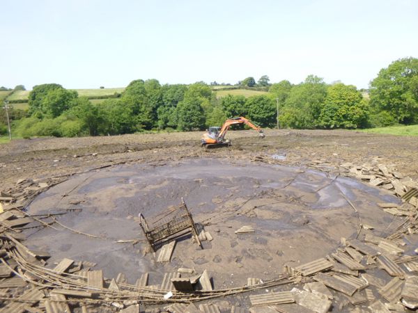 Collapsed slurry store at Glanperis Farm Collapsed slurry store at Glanperis Farm