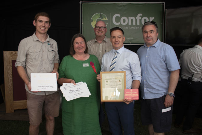 Winners of the awards standing with their certificates Winners of the awards standing with their certificates