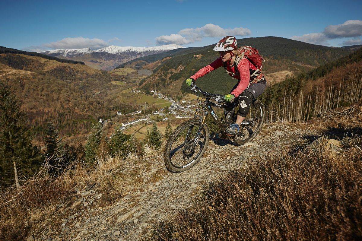Mountain biker riding the ClimachX trail above the Dyfi Valley