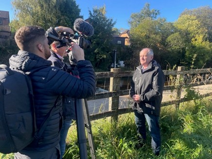 Photo showing NRW National Flood Risk Services Manager providing a media interview during Be Flood Ready campaign week