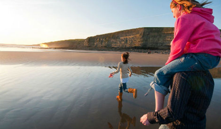 Family enjoying the beach. Image source: Visit Wales Family enjoying the beach. Image source: Visit Wales