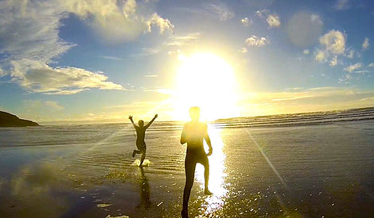 Young people running into the sea Young people running into the sea