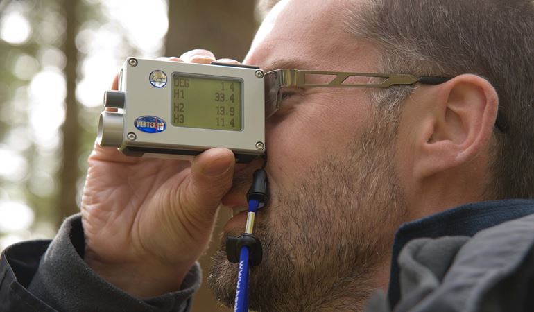 Man looking through monitoring device