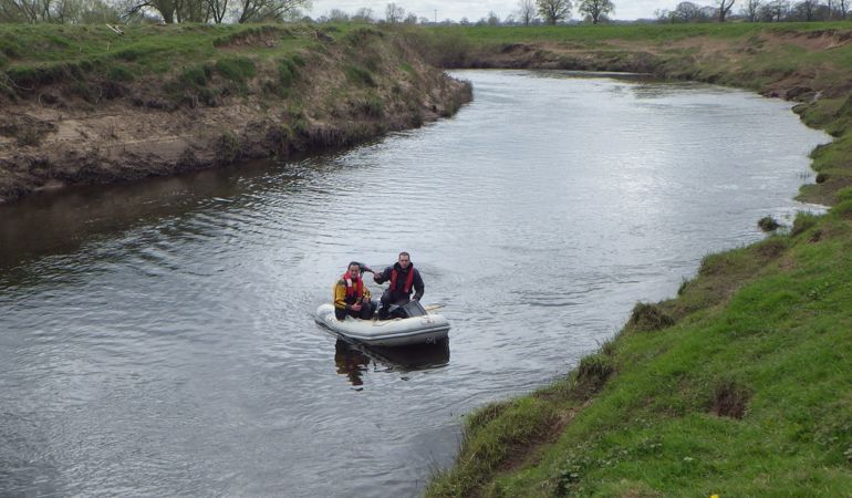 NRW officers investigating the pollution in the River Dee NRW officers investigating the pollution in the River Dee