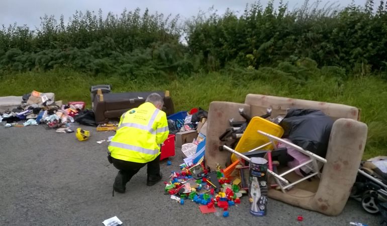 NRW staff investigating fly tipping mess NRW staff investigating fly tipping mess
