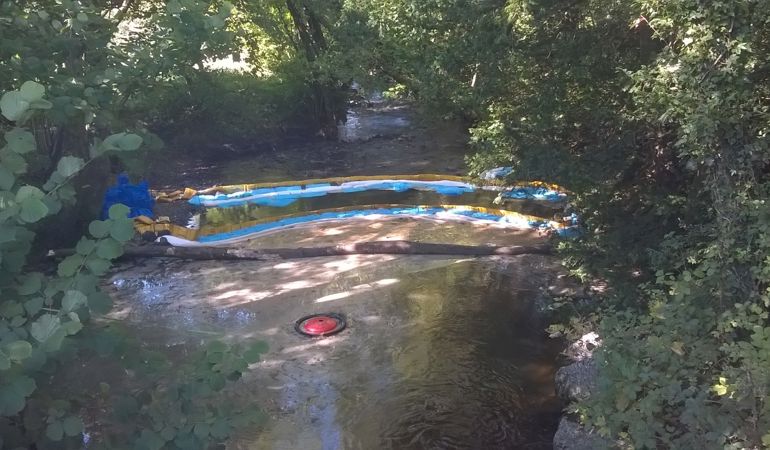 Oil spill in a river Oil spill in a river