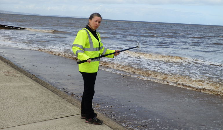 Testing water quality at Rhyl beach Testing water quality at Rhyl beach
