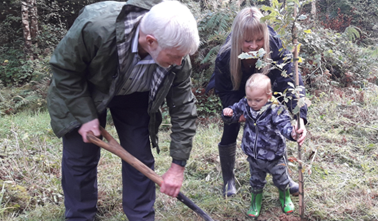 Terry Davis and Caroline riches planting an oak tree
