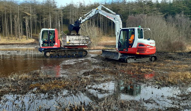 Diggers working on site at Newborough