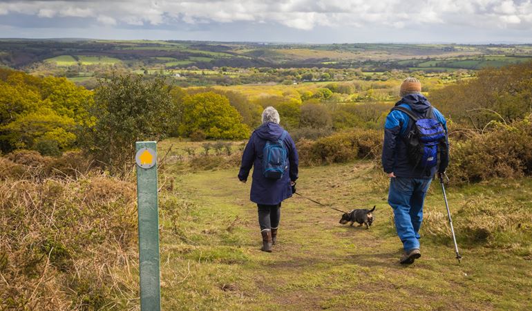 People walking on a public footpath in the countryside