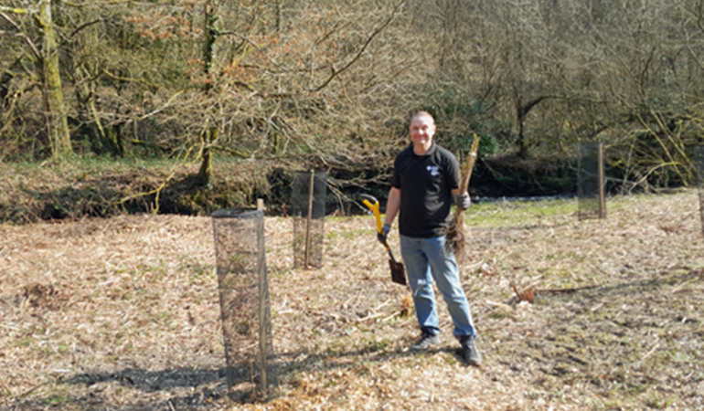 NRW staff planting Cherry tree at Abercarn picnic site 