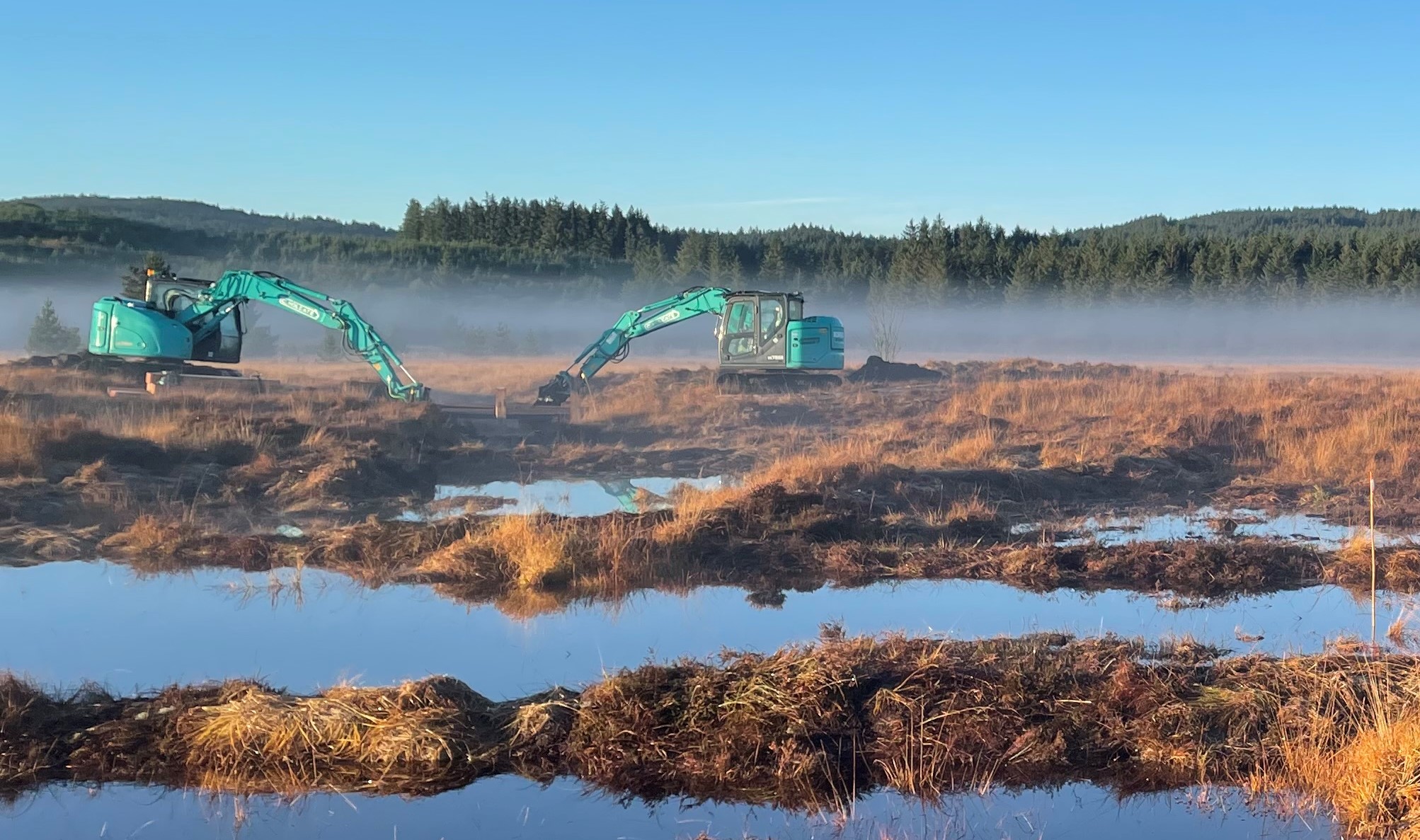 Equipment on peatland site restring to re-wet the landscape 