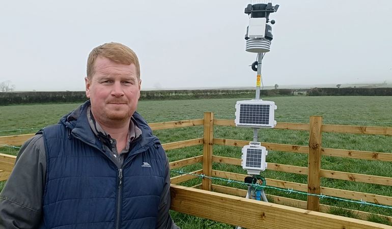 Michael Williams with weather station installed at Fagwr Fran East Farm in Pembrokeshire