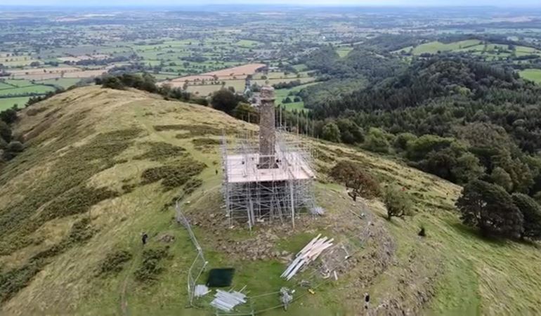 Rodney's Pillar on a hilltop surrounded by scaffolding 