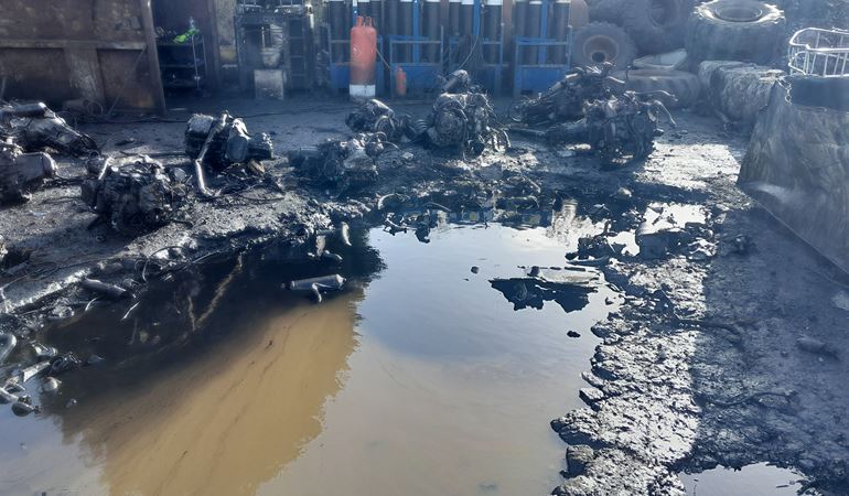 Oil contamination and poor state of the impermeable pad at Ammanford Recycling Ltd.