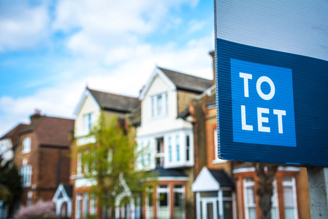 To let sign in front of houses To let sign in front of houses