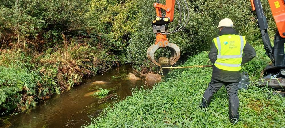 Long reach machinery placing boulders – credit NRW Long reach machinery placing boulders – credit NRW